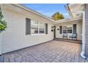 Inviting front patio with brick pavers and comfortable seating at 3306 Florene Dr, Orlando, FL 32806