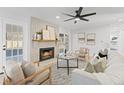 Bright living room with fireplace, hardwood floors, and ample seating at 417 Main Trl, Ormond Beach, FL 32174