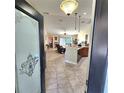 View of living room and kitchen from entryway at 510 N Leavitt Ave, Orange City, FL 32763