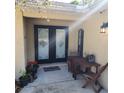 Front entry with double doors and a small patio at 510 N Leavitt Ave, Orange City, FL 32763