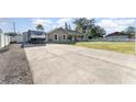 Long concrete driveway with RV parking at 5572 Myakka Ave, Intercession City, FL 33848