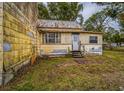 Yellow house with back door and yard at 750 E Pearl St, Bartow, FL 33830