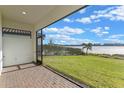 Screened patio overlooking a lake with a grassy area at 11346 Lemon Lake Blvd, Orlando, FL 32836
