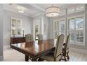 Formal dining room features a large wood table and window shutters at 13871 Briand Ave, Orlando, FL 32827