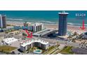 Aerial view of condo 2626, showing beach access and proximity to surrounding businesses and neighborhood at 2626 S Atlantic Ave # 102, Daytona Beach Shores, FL 32118