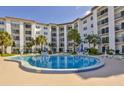 Inviting pool and deck at condo featuring multiple seating and lounge options at 2626 S Atlantic Ave # 102, Daytona Beach Shores, FL 32118