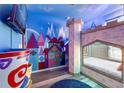 Themed bedroom with castle bunk bed and mural at 2735 Calabria N Ave, Davenport, FL 33897