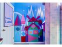Hallway with playful mural and themed decor at 2735 Calabria N Ave, Davenport, FL 33897