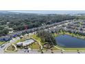 Aerial view showing home's location near pool and lake at 2775 Red Horse Dr, Kissimmee, FL 34744