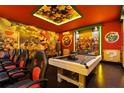 Super Mario themed game room with pool table and gaming chairs at 3083 Mahalo Dr, Davenport, FL 33897