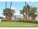 Stonefield community entrance with lush landscaping and signage at 3237 River Branch, Kissimmee, FL 34741