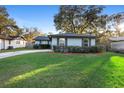 Updated home exterior with well-manicured lawn at 328 E Hillcrest St, Altamonte Springs, FL 32701