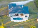 Aerial view showing house, pool, and large backyard at 720 Napoli Ln, New Smyrna Beach, FL 32168