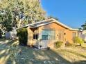 Tan single-story house with a yard at 770 Carver St, Winter Park, FL 32789