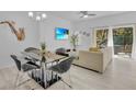 Bright dining area with glass table, metal chairs, and modern decor at 1005 Park Ridge Cir, Kissimmee, FL 34746