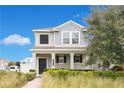 Two-story house with gray siding, shutters, and a landscaped front yard at 11006 Silver Surfer Aly, Winter Garden, FL 34787