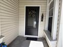 Black front door with sunflower wreath and small bench at 138 Meadow Blvd, Sanford, FL 32771