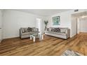 Bright living room with hardwood floors and comfy sofas at 1413 Evangeline Ave, Orlando, FL 32809