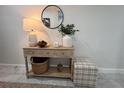 Light wood console table with decor in a home entryway at 1490 11Th Ave, Deland, FL 32724