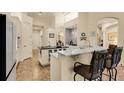 Spacious kitchen with a breakfast bar and white cabinets at 237 Hazeltine Dr, Debary, FL 32713