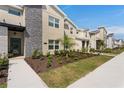 Townhome community featuring multiple units and manicured lawns at 2600 Reading Trl, Kissimmee, FL 34746