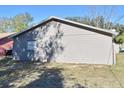 Gray single story house with a single window and block wall at 3362 Janet St, Apopka, FL 32712