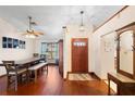 Dining area with hardwood floors and a wooden table set at 3425 Suzette Dr, Kissimmee, FL 34746