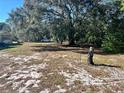 Vacant lot with mature trees and some ground cover at 3457 Seminole St, Gotha, FL 34734