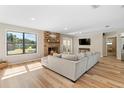 Spacious living room with fireplace, hardwood floors, and french doors at 43 Dahlia Dr, Debary, FL 32713