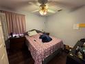 Bedroom with double bed, dresser, and window coverings at 551 Lake Charles Dr, Davenport, FL 33837