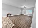 Spacious living room with wood-look floors and ceiling fan at 5998 Sw 154Th Street Rd, Ocala, FL 34473