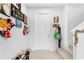 Bright entryway with tile floors, and stairs leading upstairs at 671 Bloom Ter, Davenport, FL 33837