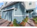 Teal-colored house exterior with a well-maintained front entrance at 671 Bloom Ter, Davenport, FL 33837