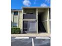 Condo building exterior with stairs and screened patio at 950 Lake Destiny Rd # E, Altamonte Springs, FL 32714