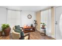 Living area with hardwood floors, two armchairs, and a sofa at 122 Magnolia Dr, Winter Haven, FL 33881