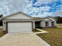 Newly constructed one-story home with attached garage at 1304 Hillsborough Ct, Kissimmee, FL 34759