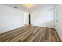 Spacious living room featuring new flooring and doors at 1630 Smithfield E Cir, Lakeland, FL 33801