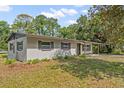 Side view of the house showcasing landscaping at 1638 Frances Dr, Apopka, FL 32703