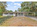 Charming ranch home featuring a covered porch at 1638 Frances Dr, Apopka, FL 32703