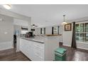 White kitchen cabinets and granite countertops at 1783 Flores Ct, Orlando, FL 32811