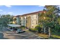 Condo building with parking and landscaping at 2705 Maitland Crossing Way # 5-107, Orlando, FL 32810