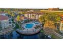 Community pool and lake with surrounding condos at 2705 Maitland Crossing Way # 5-107, Orlando, FL 32810