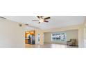 Bright living room with tile flooring, large window, and ceiling fan at 280 E Constance Rd, Debary, FL 32713