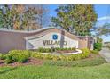 Elegant community entrance sign with landscaping at 2950 Sonata Ct, Saint Cloud, FL 34772