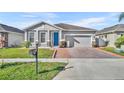 Curb appeal abounds in this charming one-story home featuring a welcoming front porch and neatly landscaped yard at 2950 Sonata Ct, Saint Cloud, FL 34772