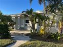 Front view of a single-story home with lush landscaping and a walkway at 335 Brookline Ave, Daytona Beach, FL 32118