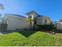 One-story house with palm trees and walkway at 5119 Santa Ana Dr, Orlando, FL 32837