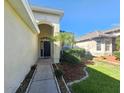 House entrance with walkway and landscaping at 5119 Santa Ana Dr, Orlando, FL 32837