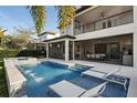 Resort-style pool with a spa and lounge chairs at 10631 Royal Cypress Way, Orlando, FL 32836