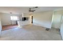 Open concept living room and kitchen with new flooring at 1416 Wilton Ave, Orlando, FL 32805